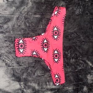 Pink bottom bathing suit with eyes